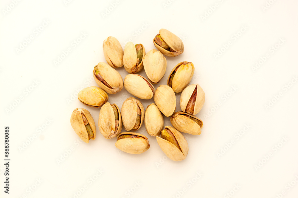 Pistachio salted nuts, healthy snack on white background.