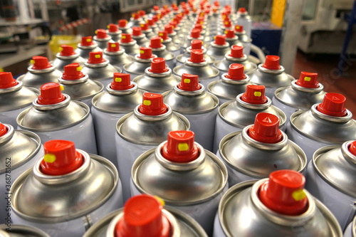 Aerosols on factory conveyor being manufactured photo