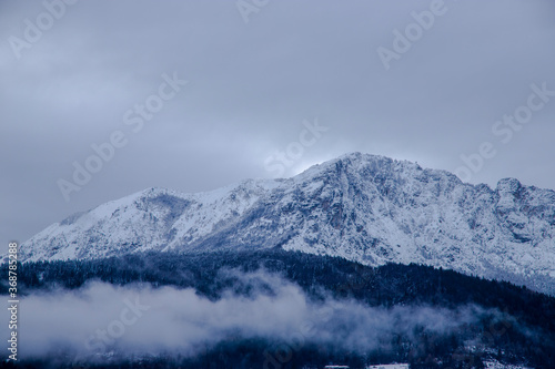 snow covered mountains and snow threatens © angeli_photography