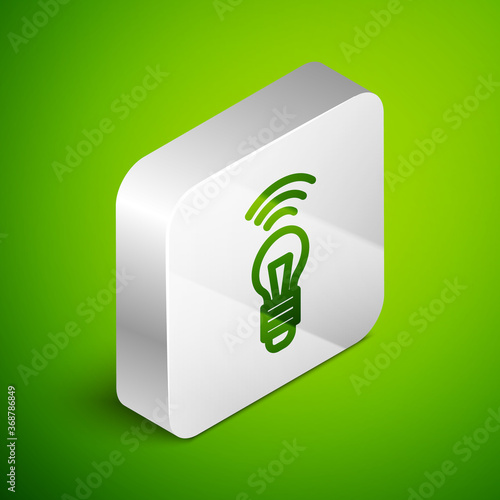 Isometric line Smart light bulb system icon isolated on green background. Energy and idea symbol. Internet of things concept with wireless connection. Silver square button. Vector.