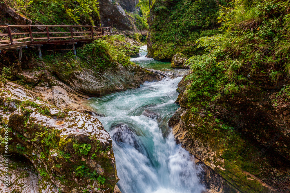 Fototapeta premium seething streams in a mountain river in an alpine gorge