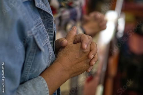 People praying together at Church. © NoonVirachada