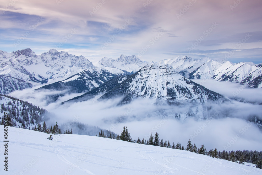 Winter panorama landscape in the Karwendel mountains at Schafreiter, with fog, snow and forest.