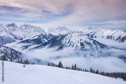 Winter panorama landscape in the Karwendel mountains at Schafreiter, with fog, snow and forest.