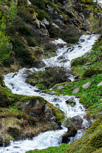 Torrent rushing down the mountain among the rocks. Chaotic mountain space in the Clarée basin. 