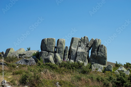 View of megaliths at the top of the mountain on blue sky background