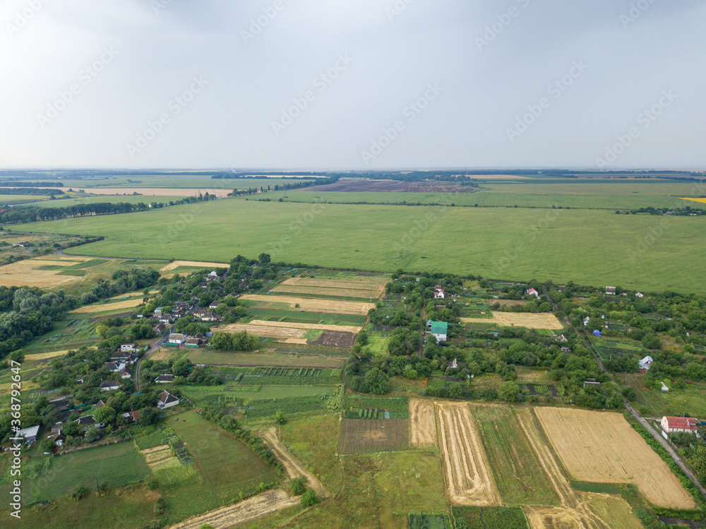 Aerial drone view. Ukrainian agricultural fields in summer.