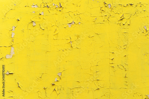 Canvas Print A yellow wall with small cracks