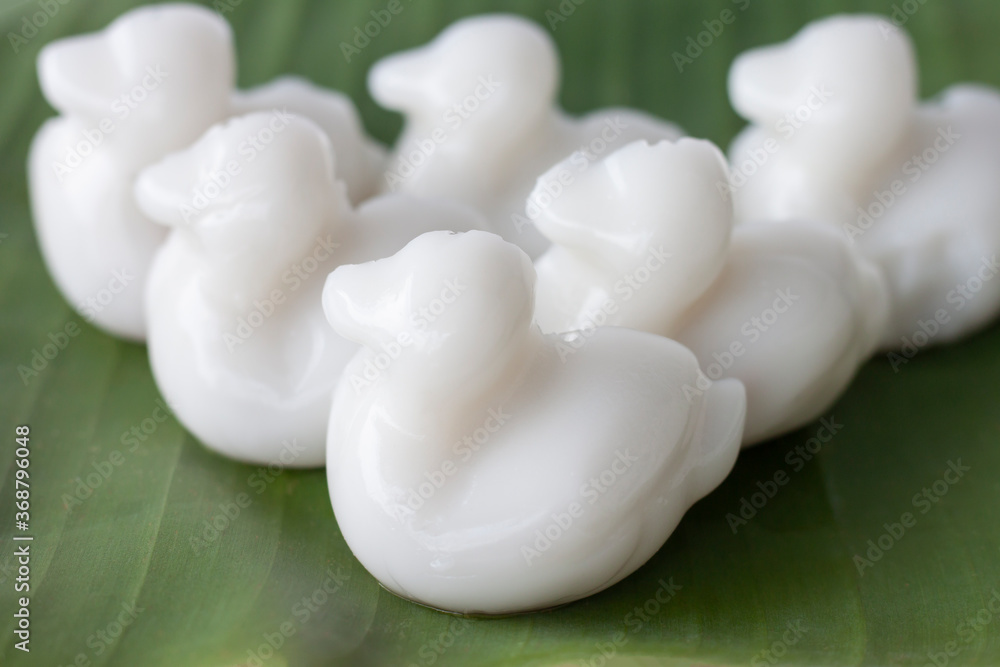 Nata de coco or young coconut milk jelly duck shape (Wun Kati) on banana leaf is a Thai dessert. Nata de coco or young coconut milk jelly duck shape (Wun Kati) on banana leaf is a Thai dessert.