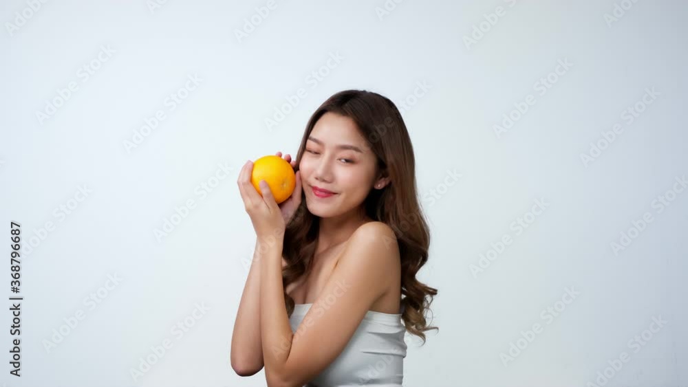 Portrait of beautiful asian woman looking to camera with attractive smile. People with beauty and skin care concept...woman smile and laugh joyfully on isolated white background.4K UHD. Portrait of beautiful asian woman looking to camera with attractive smile. People with beauty and skin care concept...woman smile and laugh joyfully on isolated white background.4K UHD.