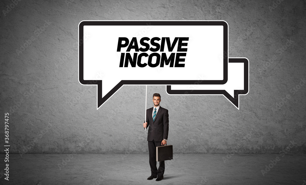 Young business person in casual holding road sign with PASSIVE INCOME inscription, new business idea concept Young business person in casual holding road sign with PASSIVE INCOME inscription, new business idea concept