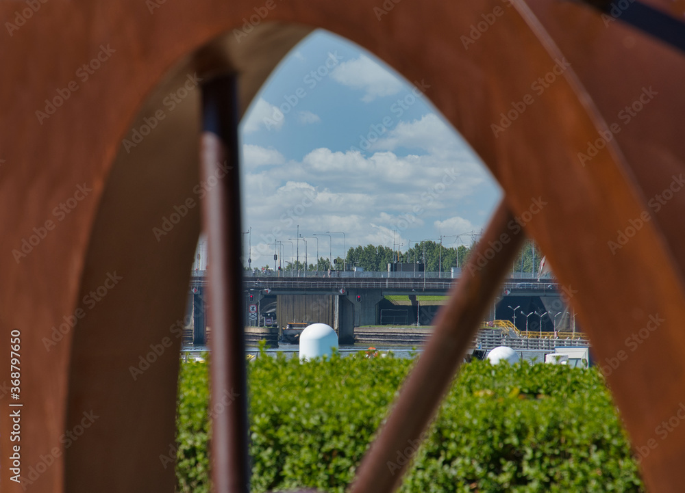 View through an iron piece from a steerwheel at the Maas in Maasbracht the Netherlands