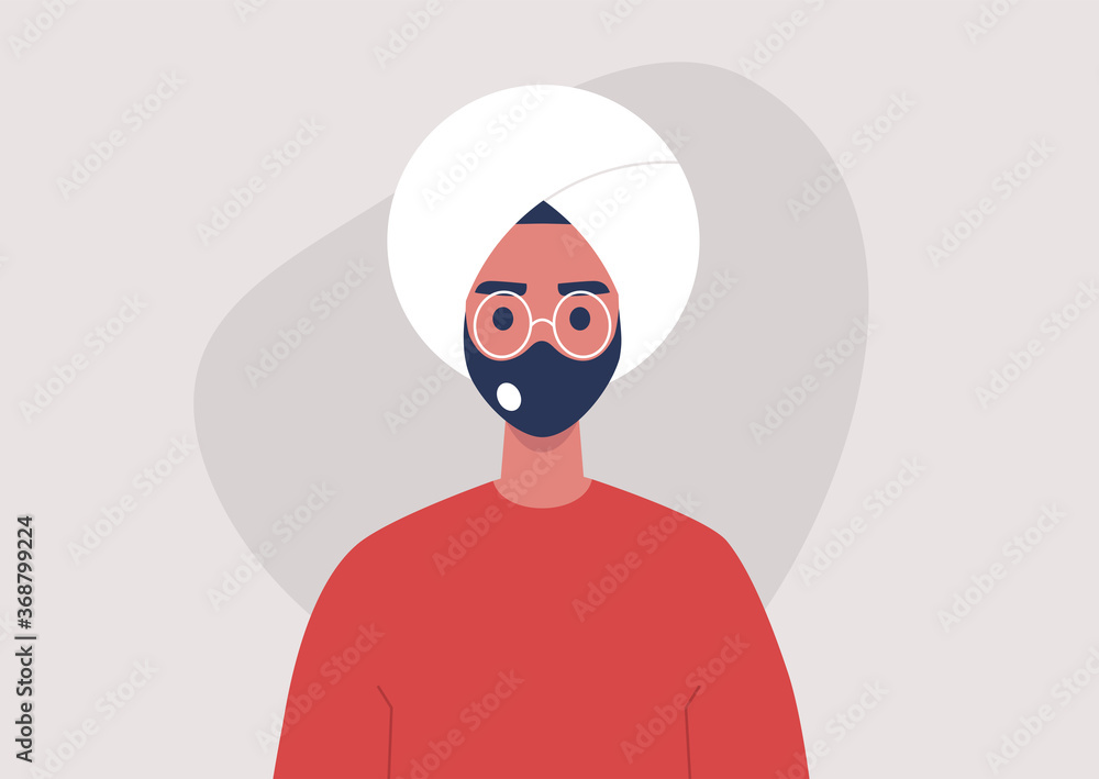 A portrait of a young indian male character wearing a protective face mask with a filter, a second wave of corona virus, covid-19 A portrait of a young indian male character wearing a protective face mask with a filter, a second wave of corona virus, covid-19
