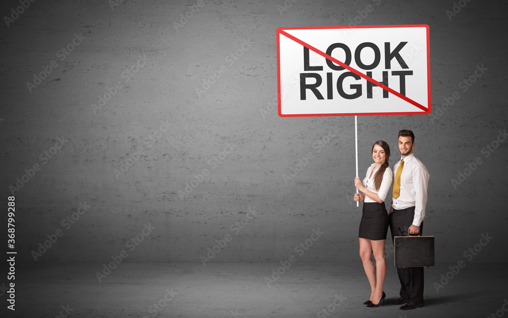 business person holding a traffic sign with LOOK RIGHT inscription, new idea concept business person holding a traffic sign with LOOK RIGHT inscription, new idea concept