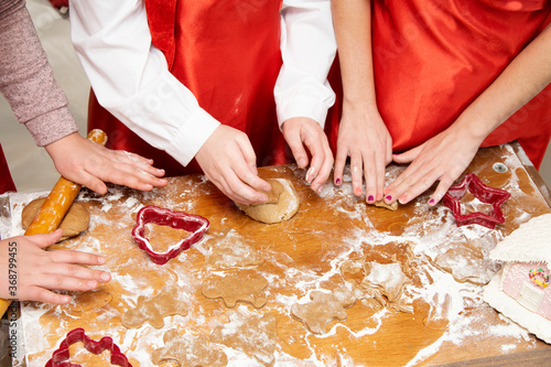 Children prepare gingerbread for Christmas.