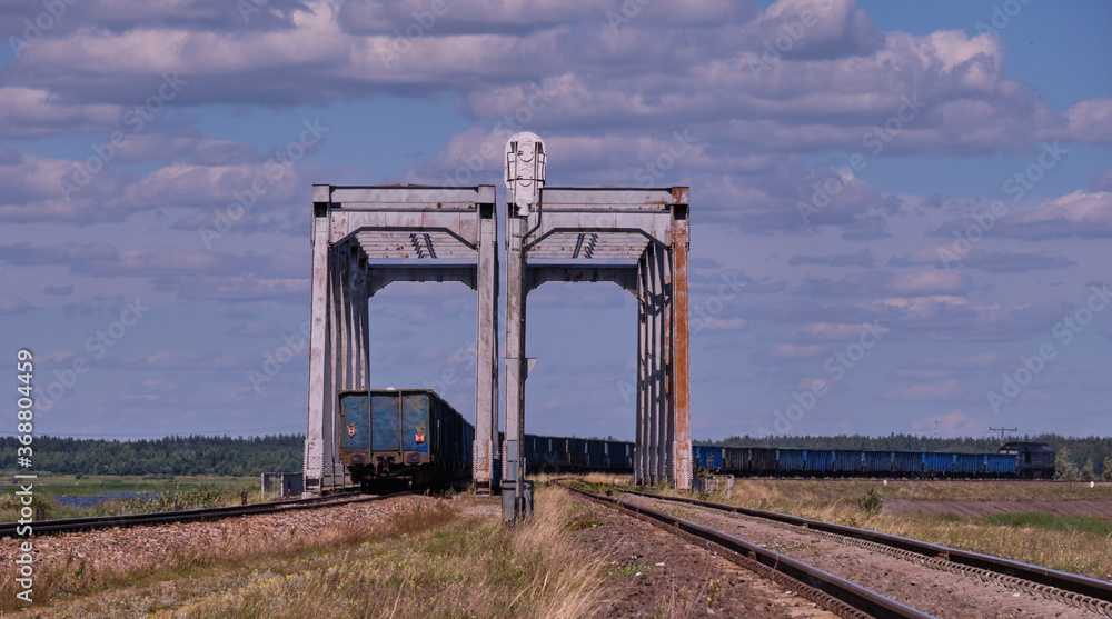 Twin railway bridge against blue sky