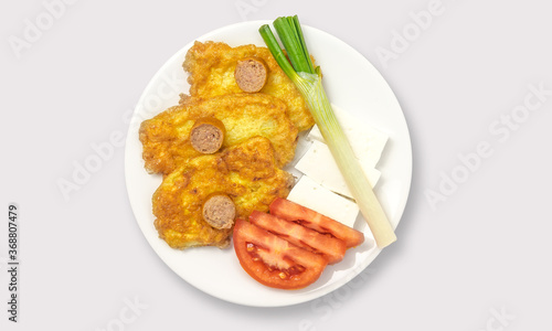 Fried food and vegetables on a white background