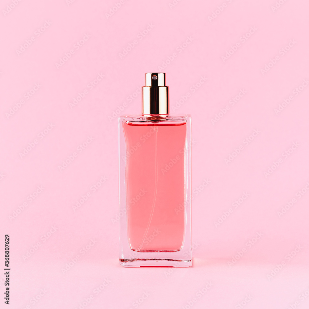 Perfume bottle on a light pink background Perfume bottle on a light pink background