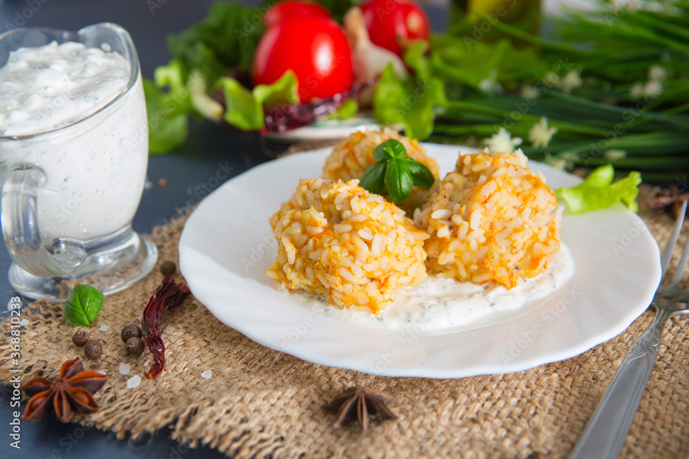 Home meatballs with spices on concrete background