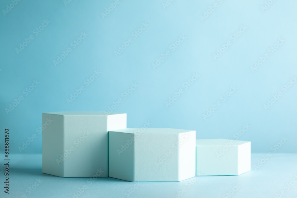 Abstract background with hexagon shape podiums for products presentation or exhibitions. Composition of different geometric objects Abstract background with hexagon shape podiums for products presentation or exhibitions. Composition of different geometric objects