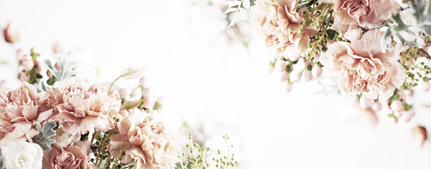 Autumn pastel composition made of beautiful flowers and berries on light backdrop. Floristic decoration. Natural floral background.