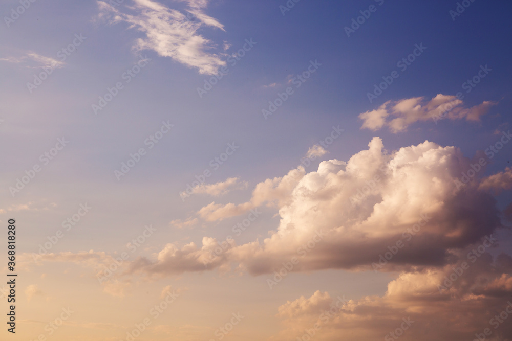Large heavy clouds slowly float across the blue beautiful sky. Stunning landscape and view. Blue sky with white clouds. .
