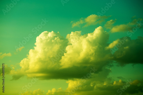 Large heavy clouds slowly float across the blue beautiful sky. Stunning landscape and view. Sky clouds . © Alik Mulikov