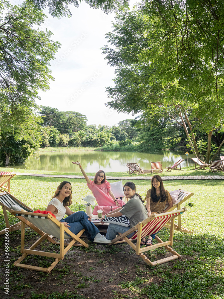 people on canvas chair in garden having afternoon tea and relaxing. people on canvas chair in garden having afternoon tea and relaxing.