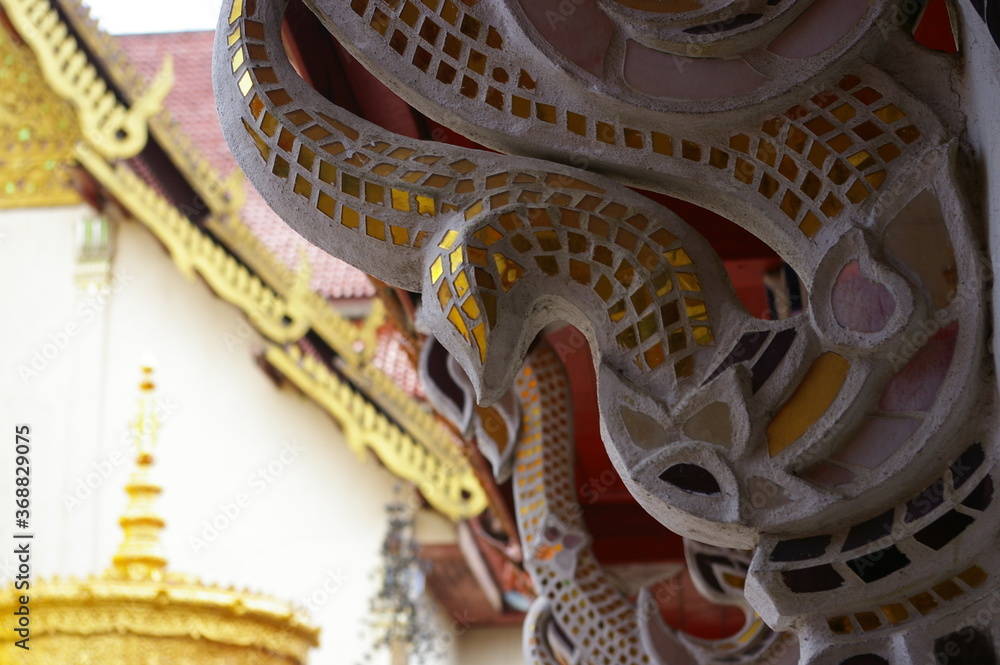 close up corbel decorated with golden glasses in thailand temple close up corbel decorated with golden glasses in thailand temple