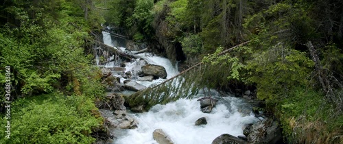 Beautiful alpine forest river neaer Grawa Waterfall in Stubai, Austria photo