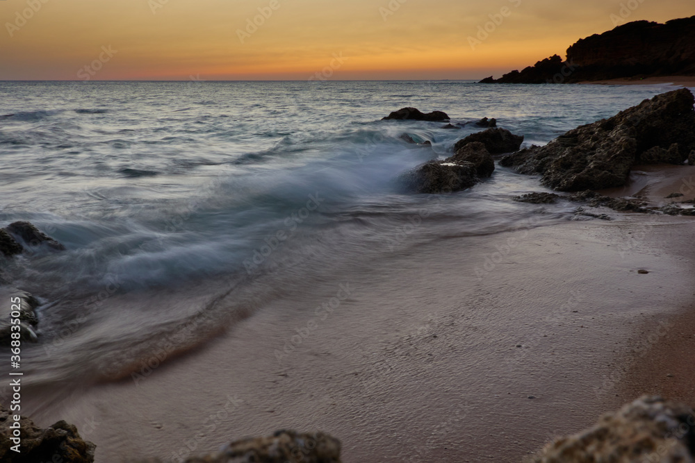 The golden hour during sunset at Cala El Frailecillo in the Calas de Roche de Conil de la Frontera. Cadiz Andalusia. Spain The golden hour during sunset at Cala El Frailecillo in the Calas de Roche de Conil de la Frontera. Cadiz Andalusia. Spain
