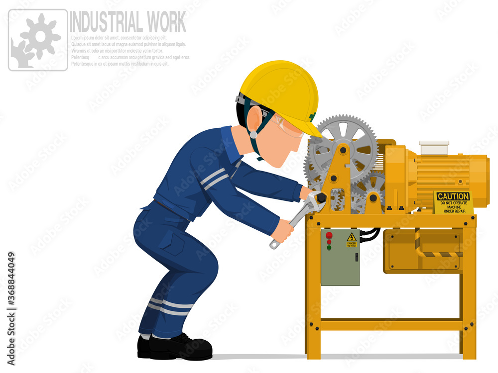 An industrial worker is repairing machine