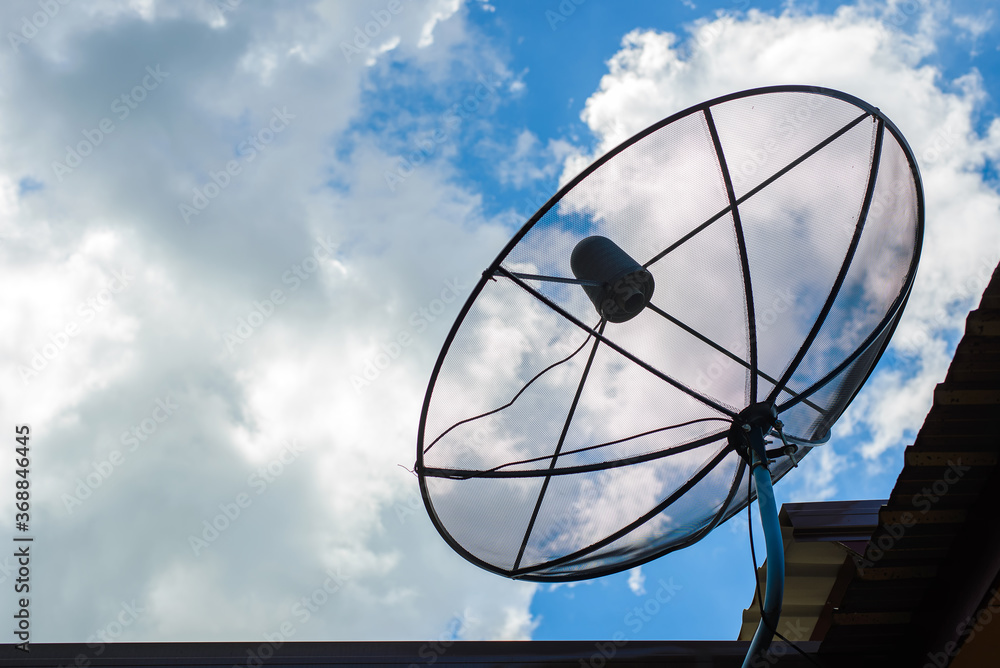 A satellite dish for TV and blue sky background