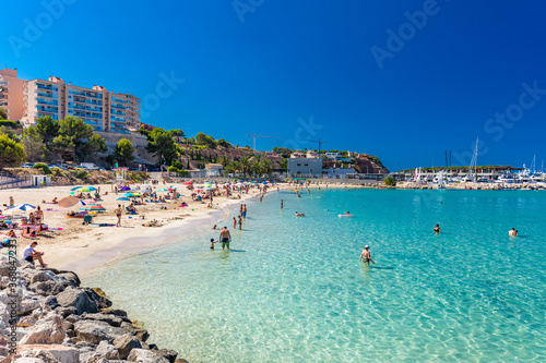 PORT ADRIANO, MALLORCA, SPAIN - 23 July 2020 - Tourists enjoying summer day on the city beach.