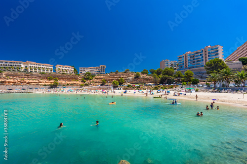PORT ADRIANO, MALLORCA, SPAIN - 23 July 2020 - Tourists enjoying summer day on the city beach.