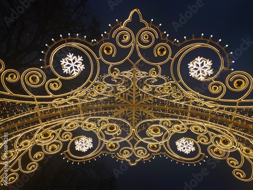 frame of light bulbs with a pattern of snowflakes, festival journey to Christmas