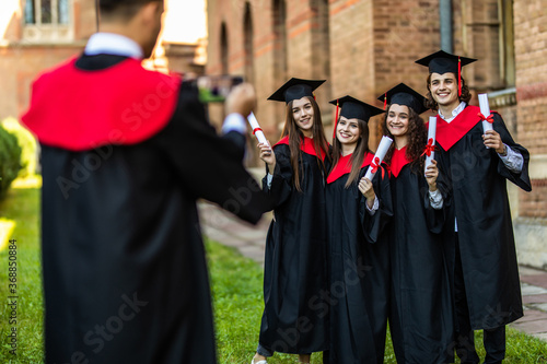 Group of students taking a picture in their graduation at University ceremony