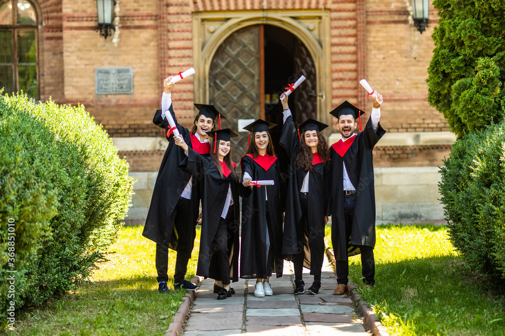 Graduates embrace, enjoy and look forward on the graduation ceremony ...