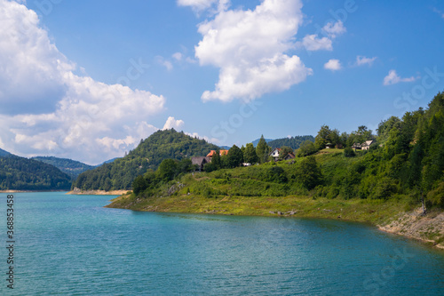 Beautiful Zaovine lake on Tara national park in Serbia, Europe. Beautiful landscape with cloudy sky, hills, and mountains. Tourism and travel concept