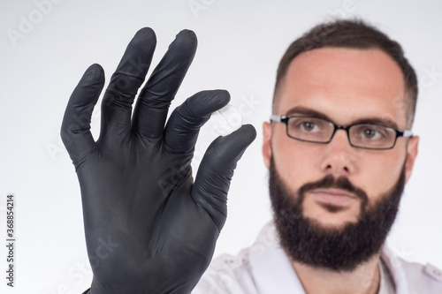 The man is holding a pill i...