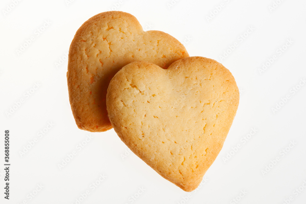 Heart shaped biscuits isolated on white background. Heart cookies for Valentine's day, Christmas and other celebrations Heart shaped biscuits isolated on white background. Heart cookies for Valentine's day, Christmas and other celebrations