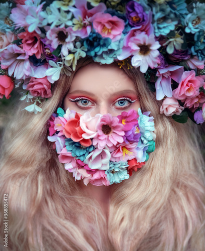Woman wearing face mask decorated with flowers