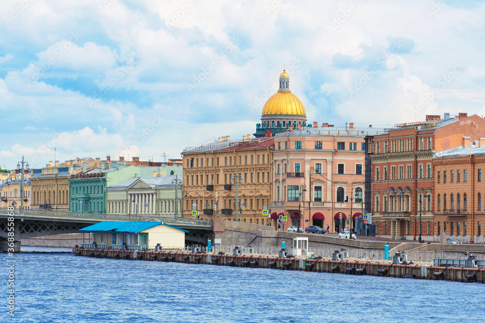English Embankment and Pier, Annunciation Bridge, St. Isaac's Cathedral, city street. Summer view of the downtown of Saint Petersburg from the Neva river