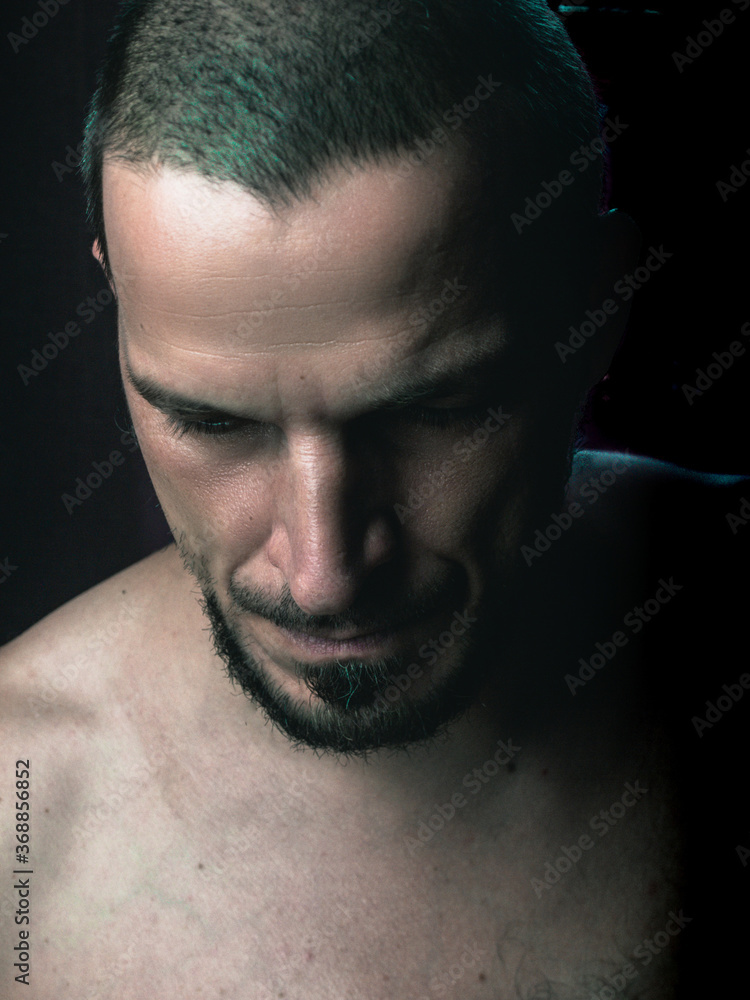 Man's portrait in a dark background
