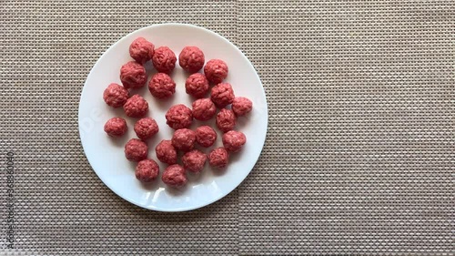 Man hands preparing meatballs with raw mincemeat. Lifestyle top view composition with natural light. Homemade cooking during lockdown, stay home housekeeping sharing concept