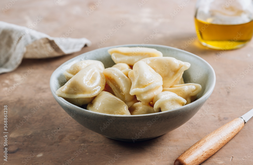 Russian, Ukrainian or Polish dish - varenyky. Dumplings, filled with cottage cheese.