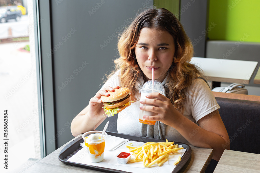 Junk food. Portrait young girl. Close-up. Junk food. Portrait young girl. Close-up.