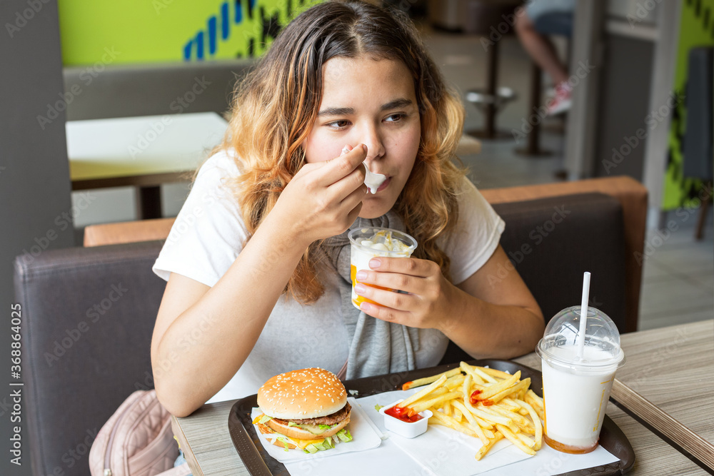 Junk food. Portrait young girl. Close-up. Junk food. Portrait young girl. Close-up.