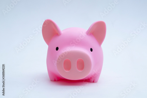 Piggy Bank with coins on a white background.