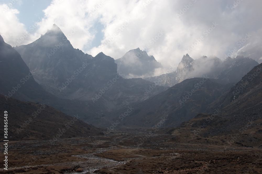 Clouds over rocky mountains, Everest region, Himalaya, Nepal